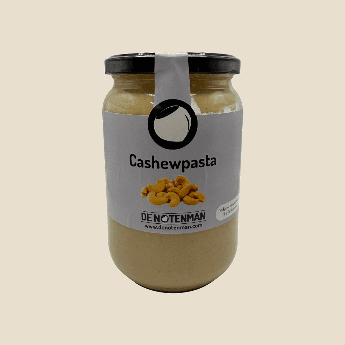 Glazen pot cashewpasta met zwart deksel en etiket van De Notenman