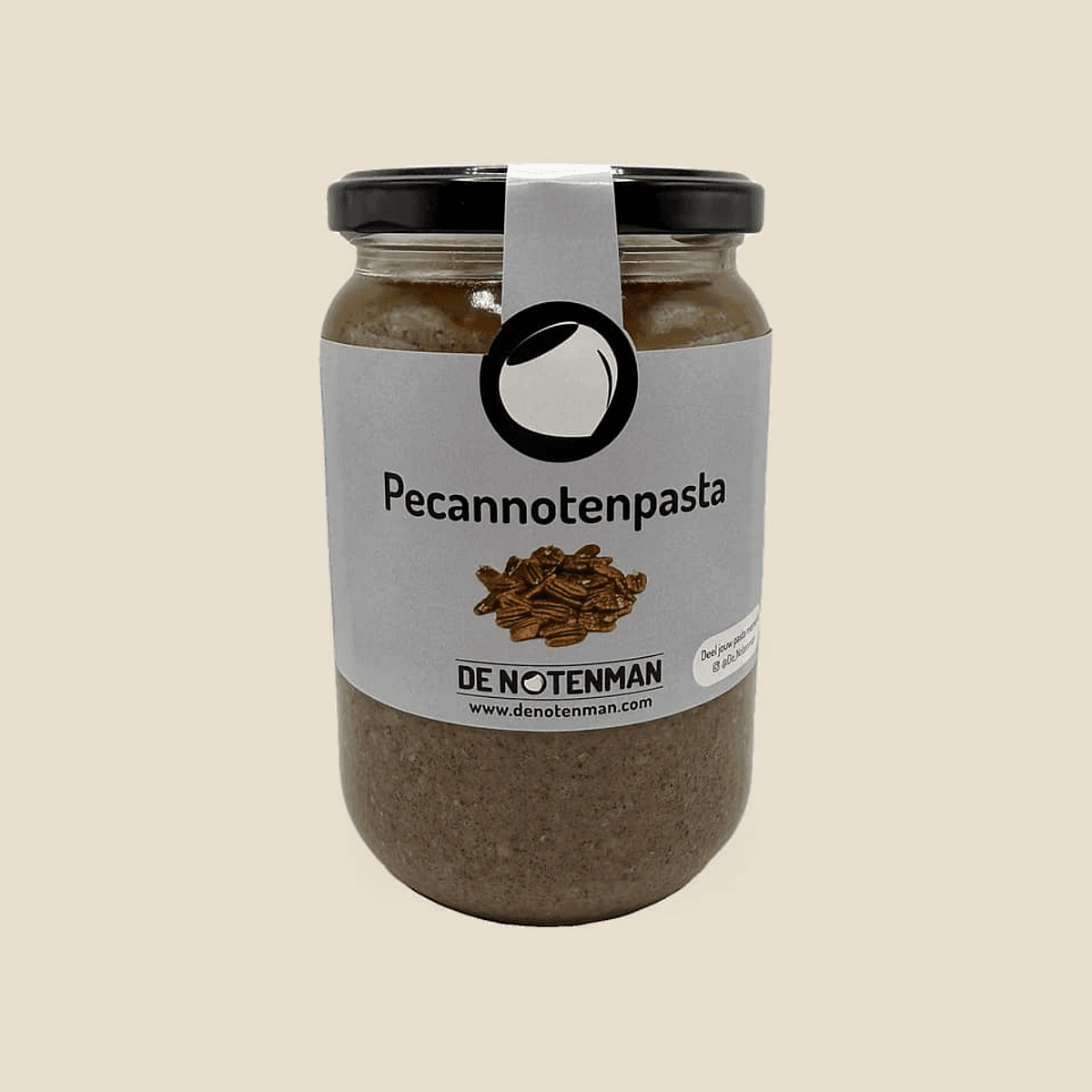 Glazen pot pecannotenpasta met etiket van De Notenman