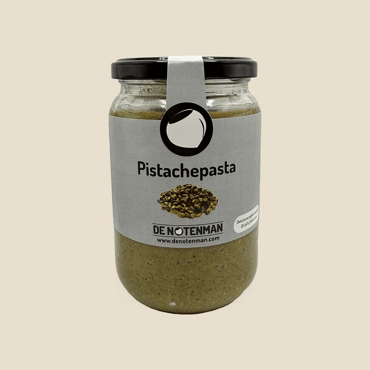 Glazen pot pistachepasta met etiket van De Notenman